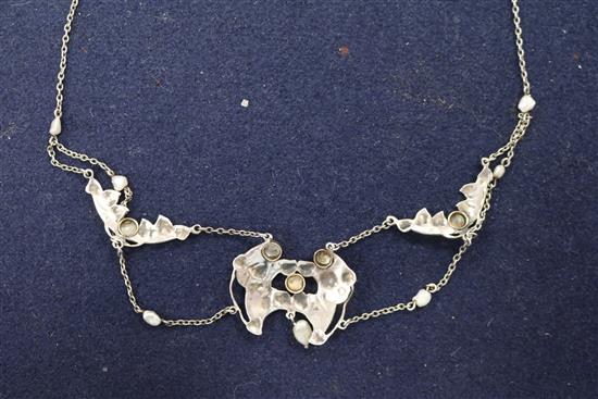 An early 20th century Art Nouveau white metal, enamel and seed pearl necklace, approx. 40cm.